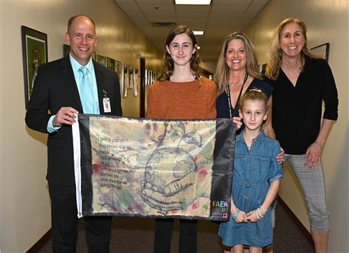 Hadley with her winning Youth Art Flag